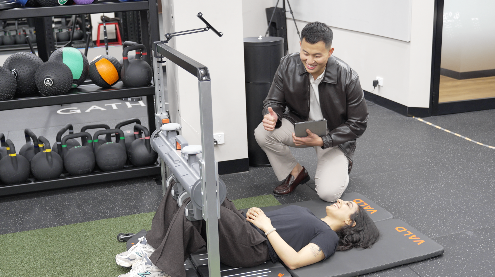 Patient performing a data-driven rehabilitation exercise with neck measurement equipment